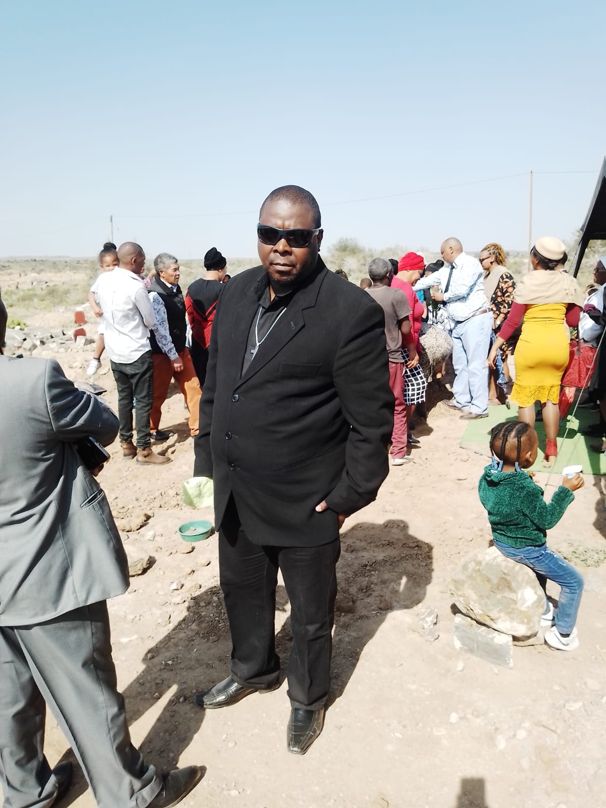 Community gathered at a graveside service