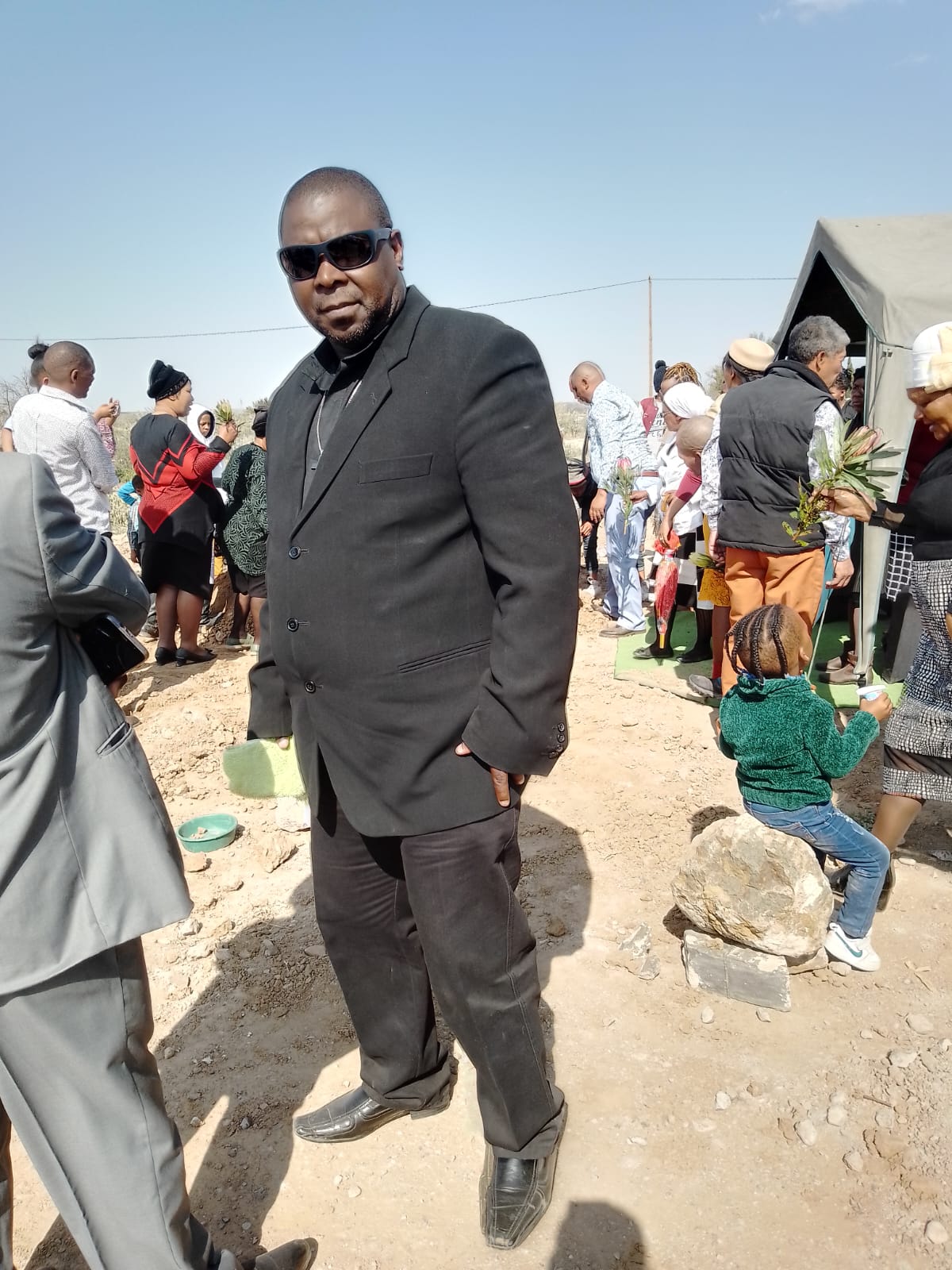 G.H.G. team member overseeing a funeral service