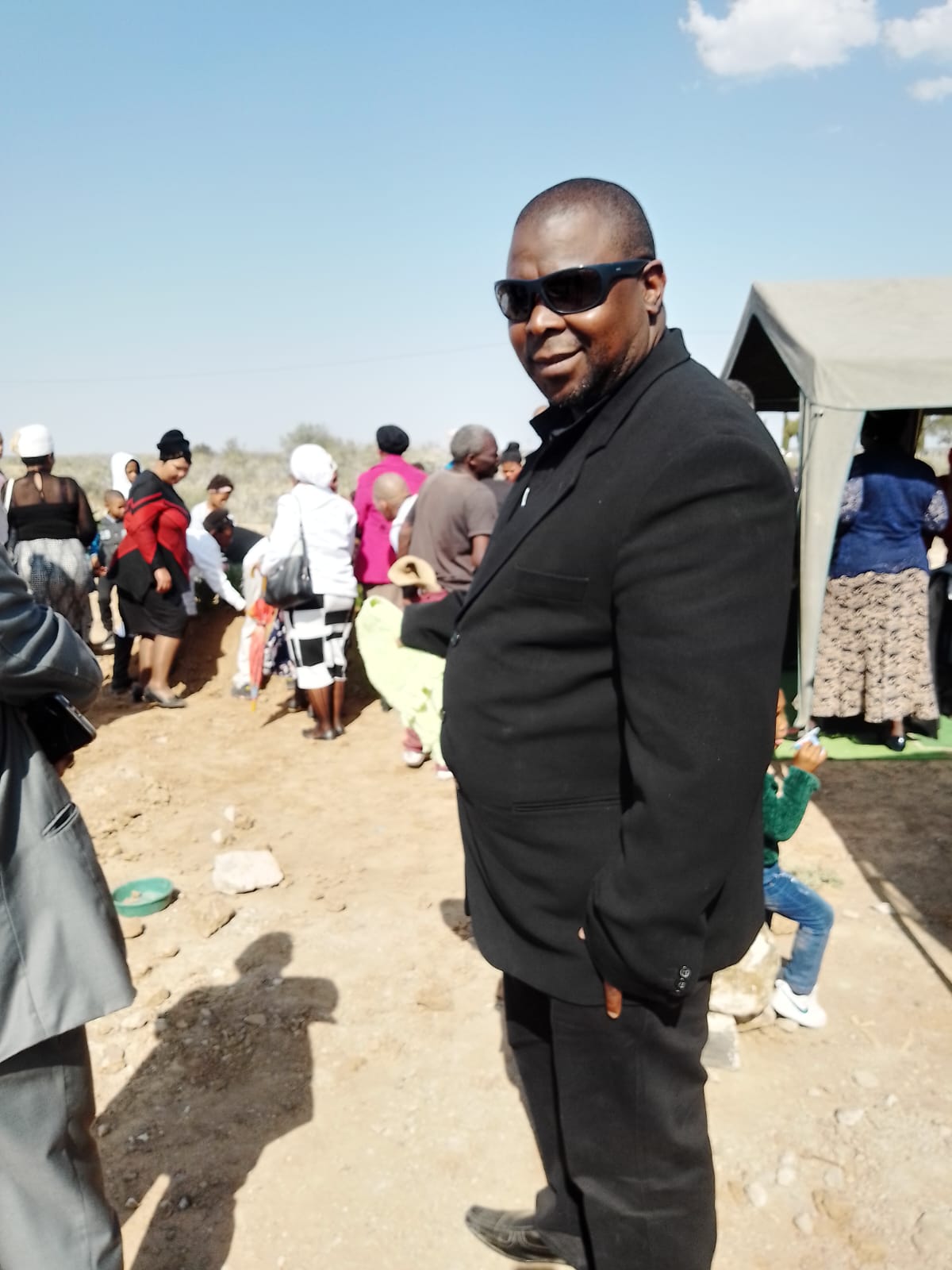 Funeral director attending to mourners