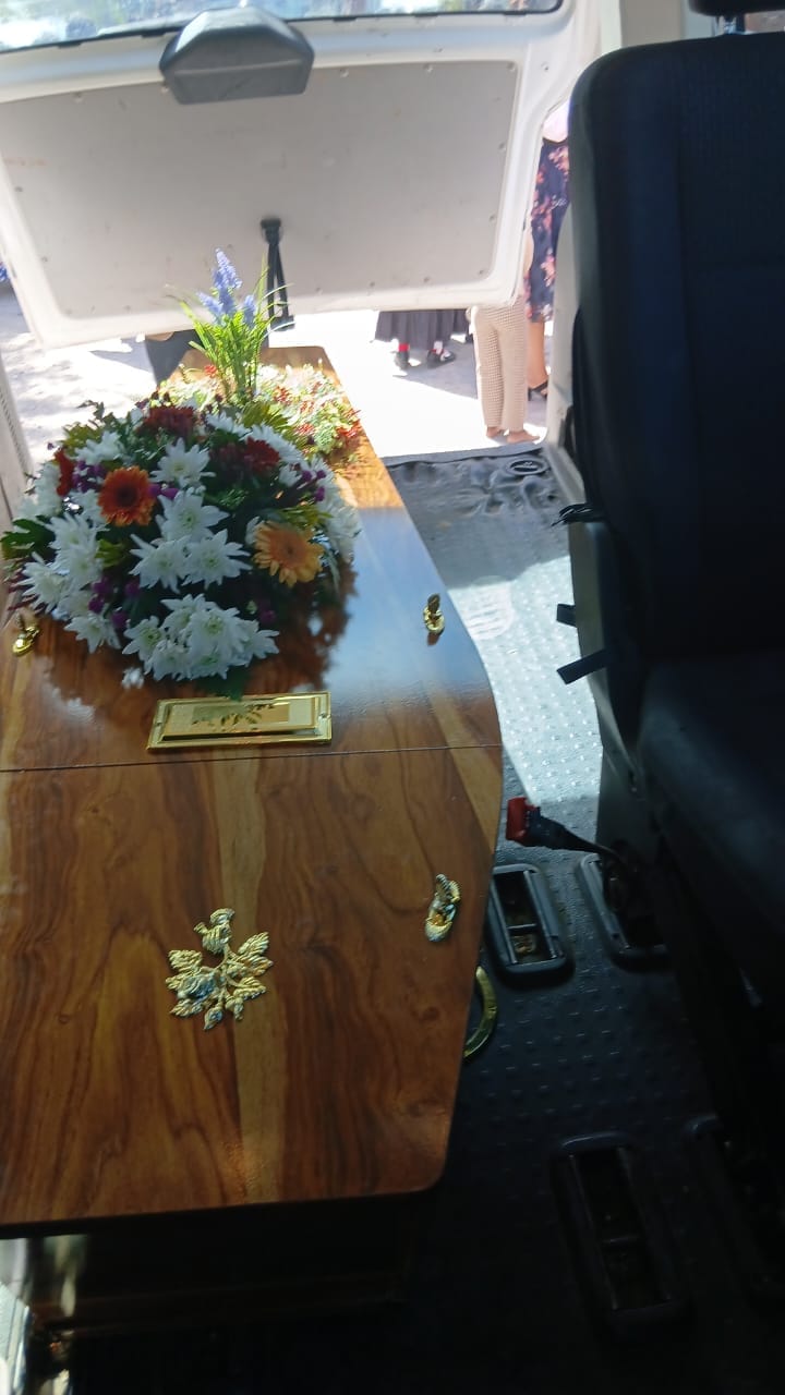 Casket dressed with flowers ready for the service