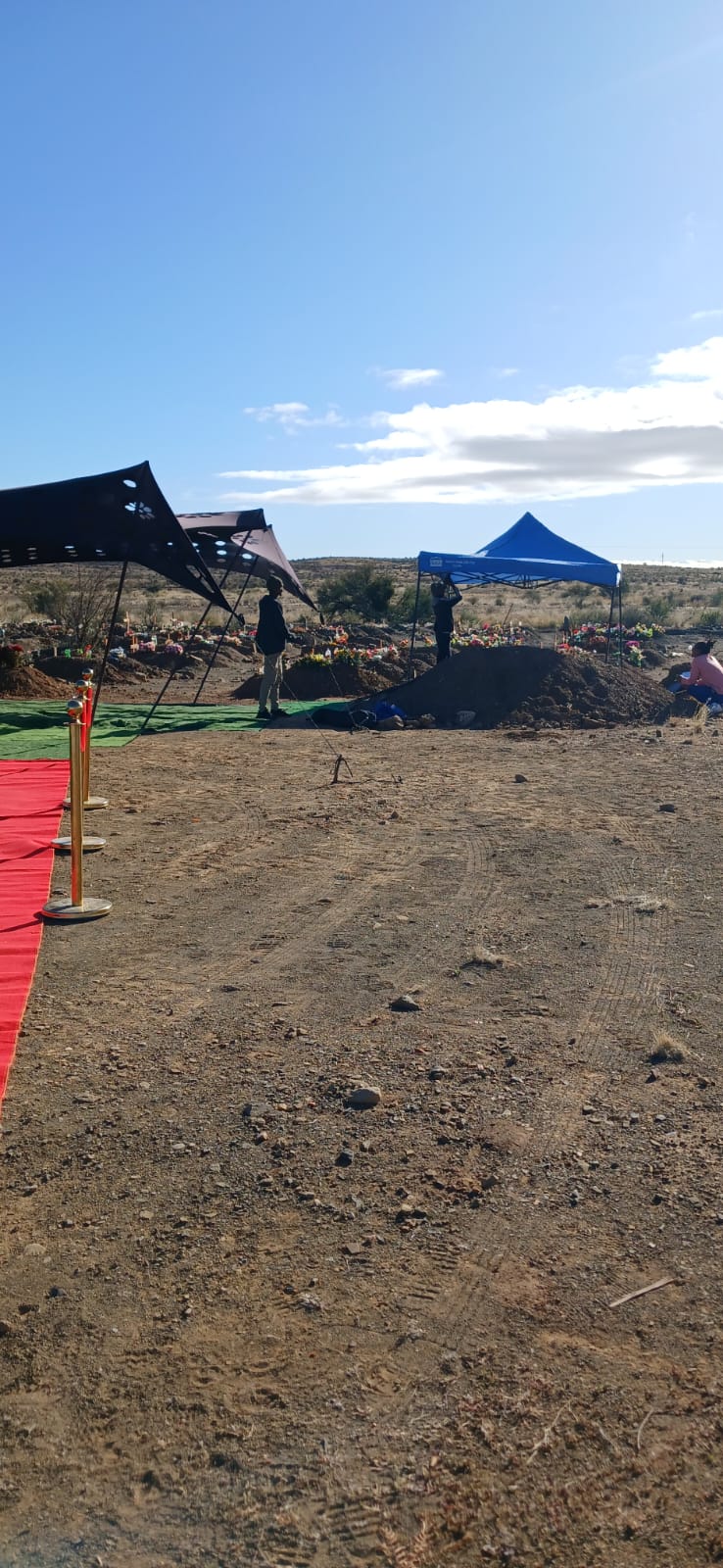 Marquee and red carpet set up for a funeral service